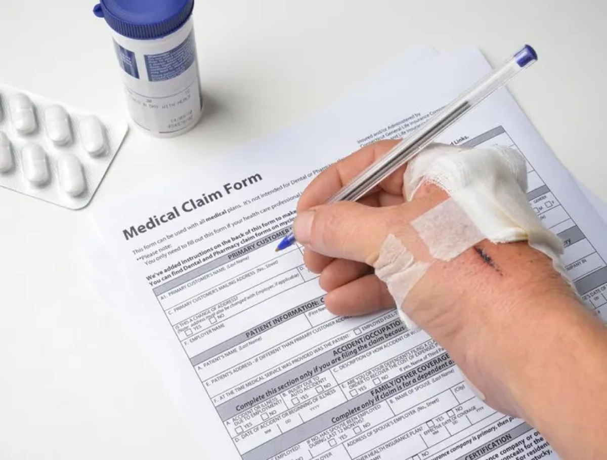 Medical professional reviewing digital health data on tablet